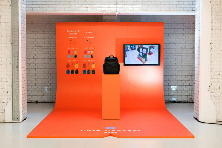 orange bag installation for hunter boots in industrial tiled alcove